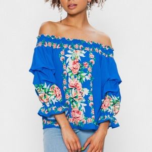 Royal blue floral flying tomato brand top